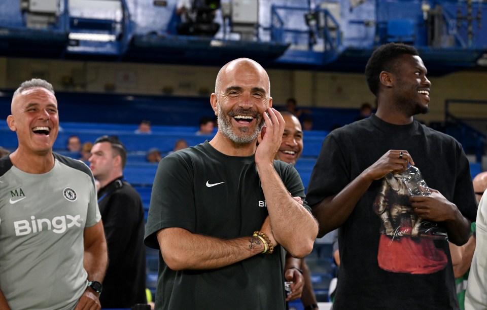 Enzo Maresca, head coach of Chelsea, smiling after a match.