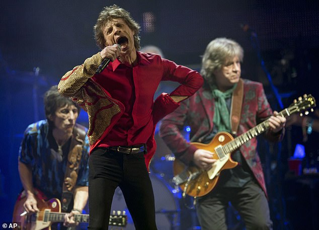 Acts such as KISS and The Rolling Stones have embraced the futuristic hologram trend – with Mick Jagger cheekily noting you can 'have a posthumous business now' (pictured performing on the Pyramid main stage at Glastonbury in 2013)
