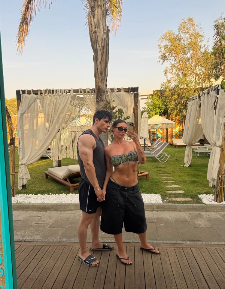 Couple taking a selfie at a resort.