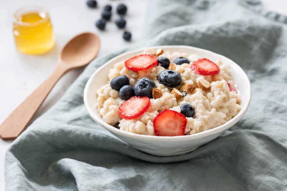 Porridge with berries in a bowl. Healthy food, healthy breakfast, clean eating concept