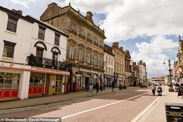 Mr Davies said the community has come together to support his drive to keep the signs up. Pictured: File photo of Wrexham High Street
