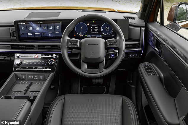 The cabin feels seriously plush, with a pair of digital displays and high-end materials across the cockpit
