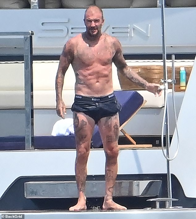 David Beckham on his superyacht in St Tropez, looking au naturel as he takes a dip