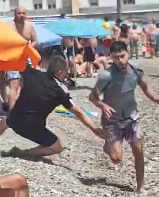 The Daily Mail has also been told that at least some of the bathers who were filmed detaining the men were off duty police officers who were enjoying a quiet Sunday on the beach