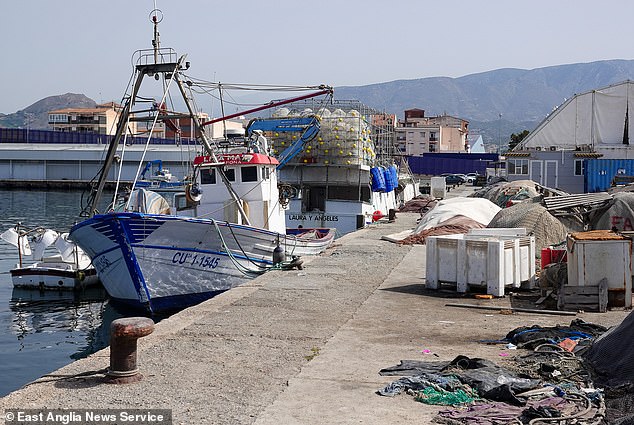 A view of boats and fishing equipment in the harbour in Motril, Spain, where migrants are held in a secure CATE detention centre