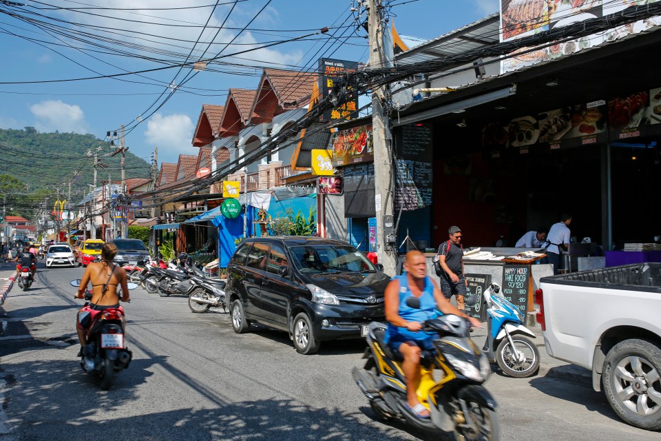 Street scene in Lamai, Koh Samui, Thailand, with restaurants and massage parlors.