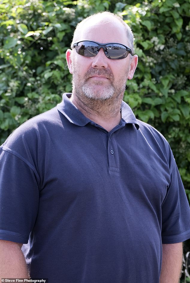 Driver Dave Morgan, 53, carries a baseball for his own protection against gangs