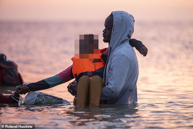 Most of the children wear lifejackets ahead of the passage (pictured)