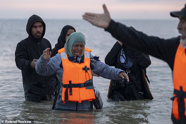 They soon variously swim and wade out to the boat (pictured)