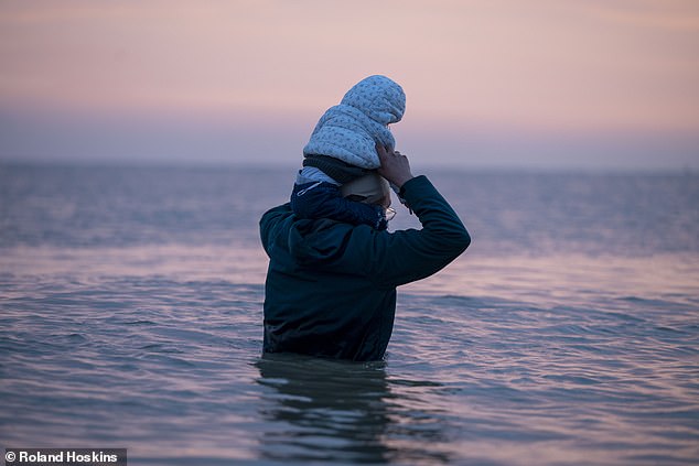 He said: 'As far as we can see, removals under this scheme will only amount to six per cent of arrivals, meaning 94 per cent will stay'. Pictured: Migrants waiting for a small boat at Gravelines beach today