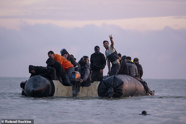 She continued: 'That sends a message to every migrant currently thinking of paying organised crime gangs to go to the UK that they will be risking their lives'. Pictured: Passengers on a small boat at Gravelines beach today