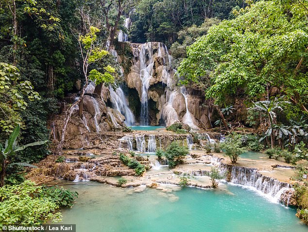 'At the Kuang Si waterfalls, in Laos, I swam and stood beneath the cascading water, laughing with sheer joy'