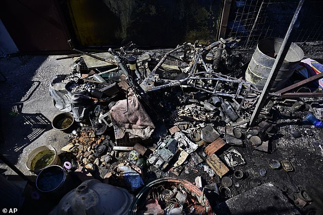 ebris lay on burned house's floor after a wildfire in Charvalo village, southeast of Athens, Greece, Saturday, Aug. 9, 2025