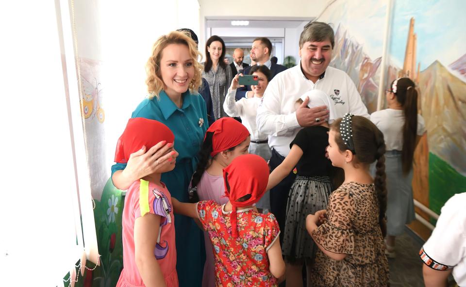 Maria Lvova-Belova with children in Chechnya.
