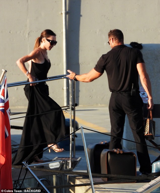 Victoria completed her look with gold heels and her signature oversized sunglasses