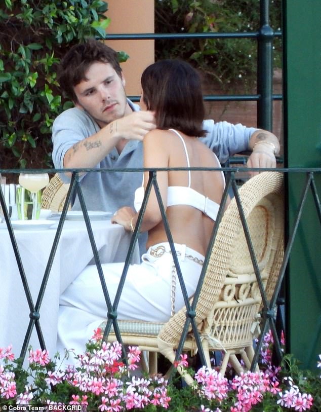 The pair put on a loved up display during the lavish meal