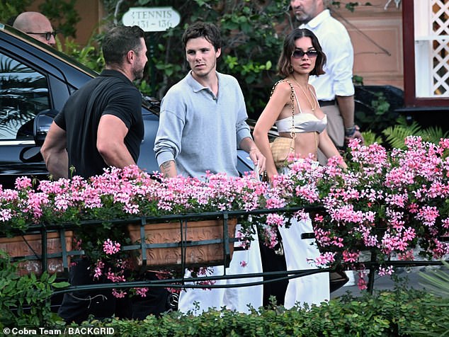 Jackie flaunted her toned physique in a tiny satin bra and a maxi skirt