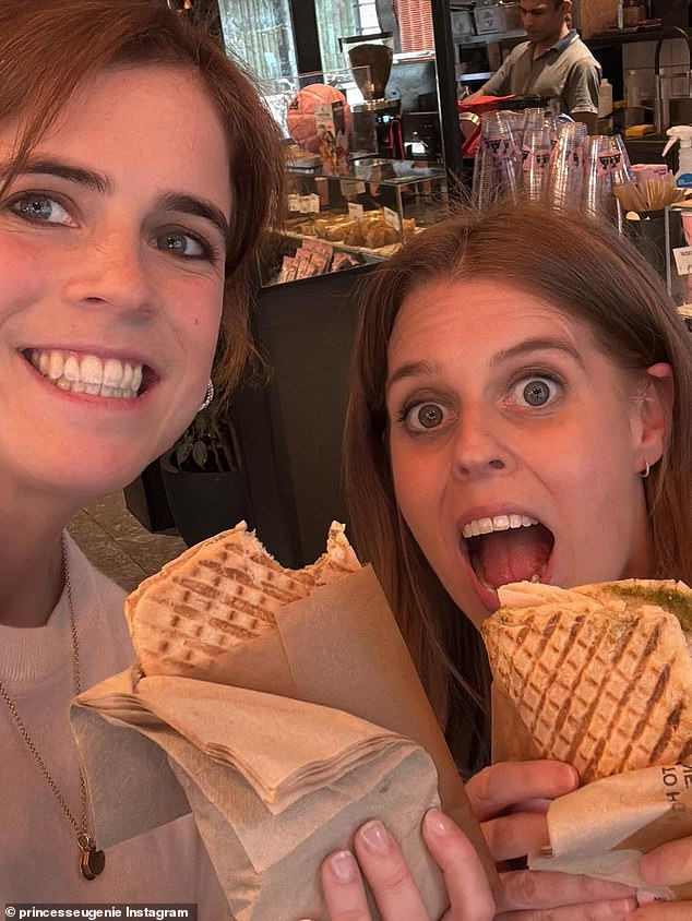 Among the images was one of Eugenie (pictured, left) and Beatrice (pictured, right) holding up panini and smiling