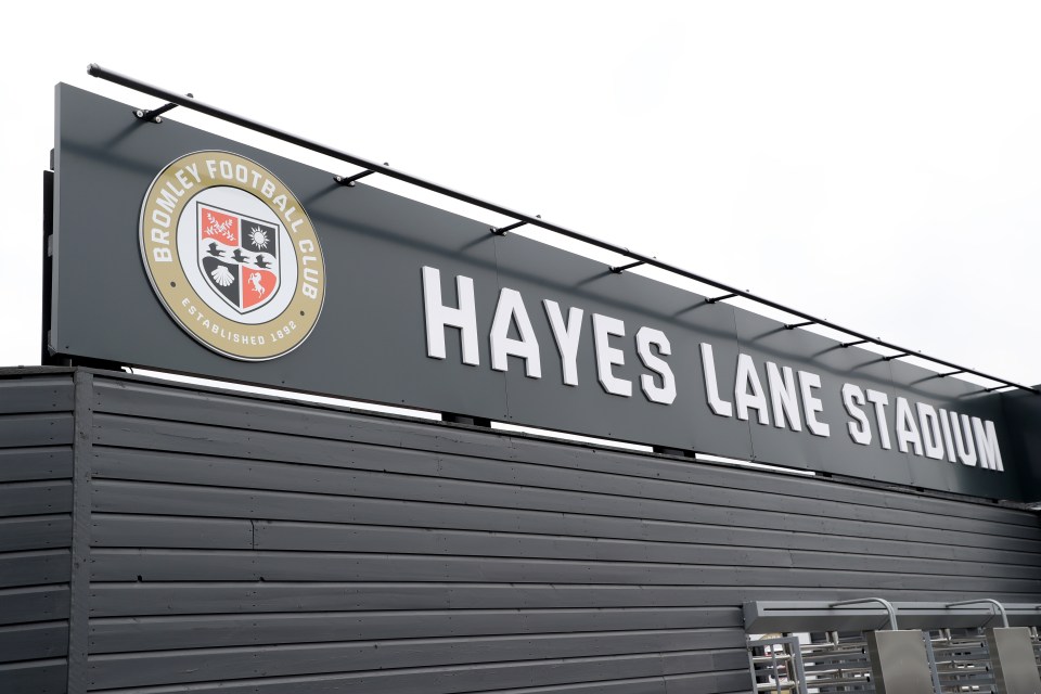 Hayes Lane Stadium sign with Bromley Football Club logo.