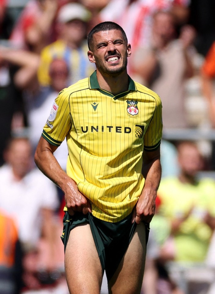 Conor Coady of Wrexham looking dejected after a soccer match.