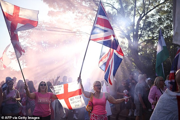 Protesters outside The Bell Hotel in Epping on Friday evening with Union Jack flags and St George's Flags