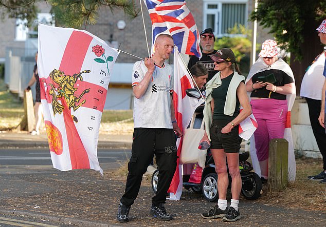Protestors gather outside the Britannia Hotel in Bournemouth on Friday after it was announced its being used as a migrant hotel