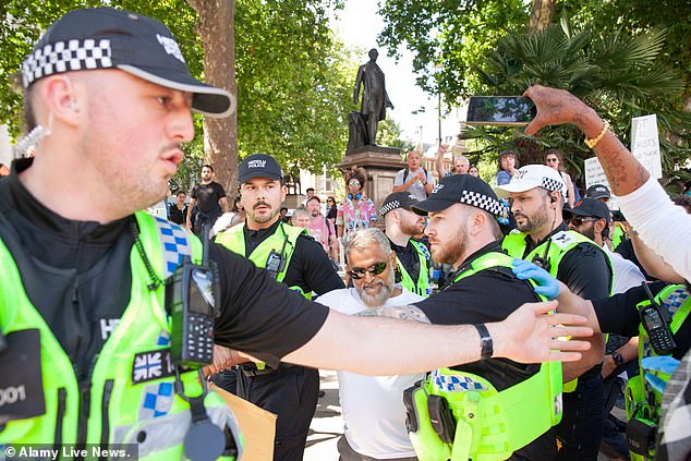 Violent scuffles broke out as officers attempted to lead those arrested away. The Met said that none of its officers was seriously injured