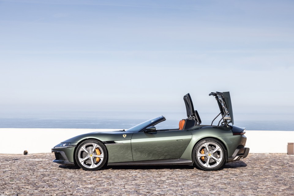Green Ferrari Roma Spyder with top up.