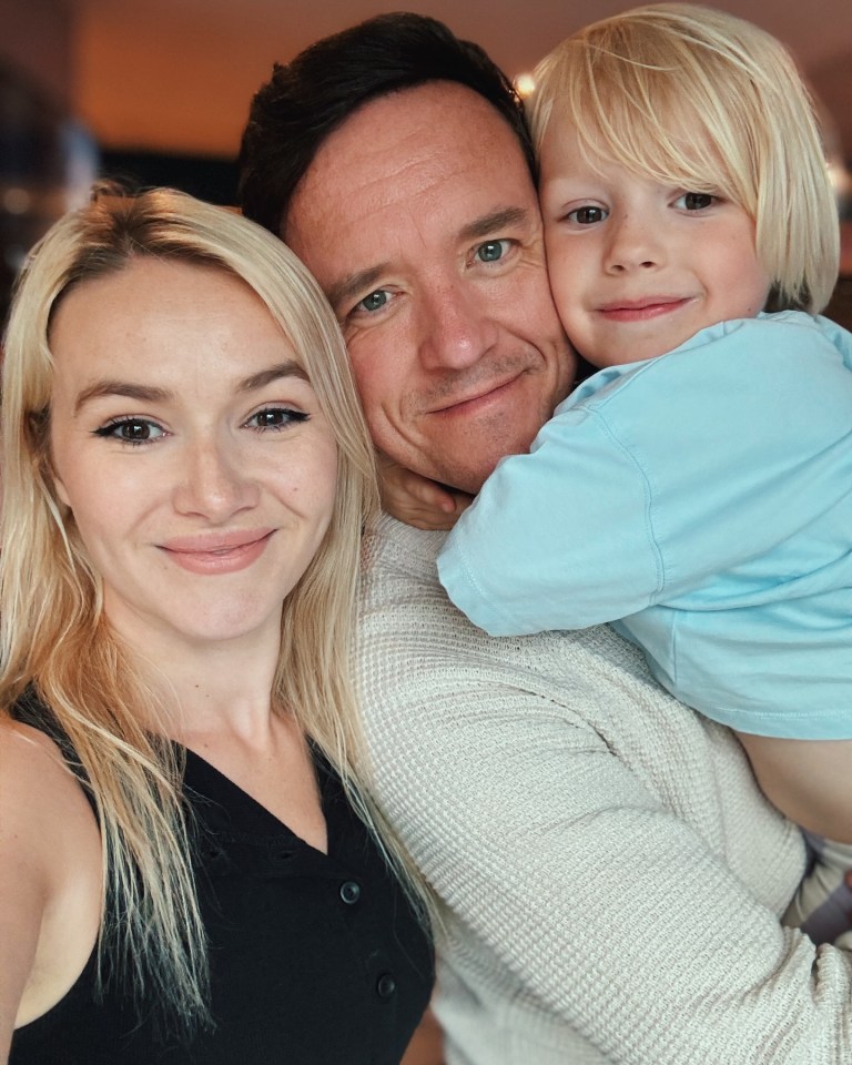 Family portrait: a woman, man, and young boy.