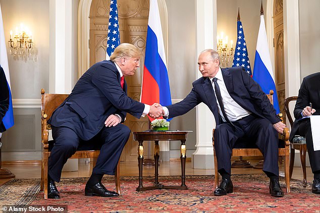 Trump tried a 'shake and yank' handshake in Osaka but Putin did not budge