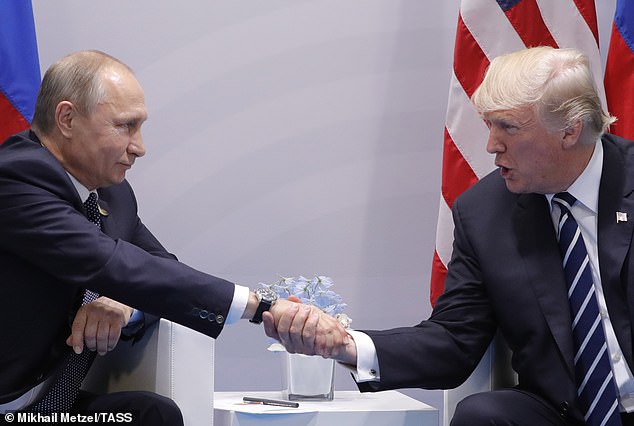 Trump performs the 'hand platter' handshake in a power move against Putin in Hamburg in 2017