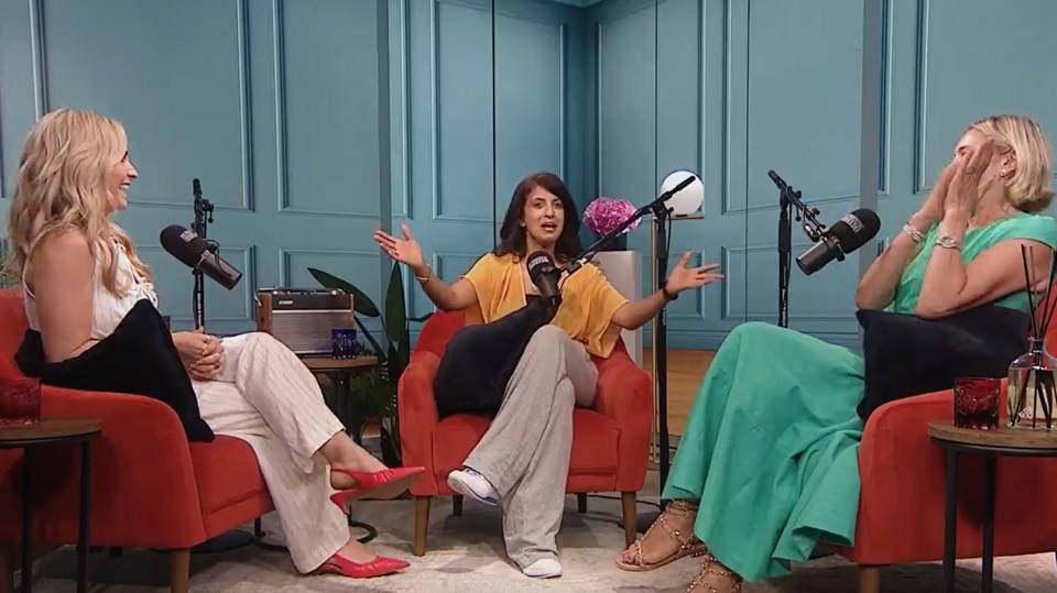 Three women sitting in chairs, talking into microphones.