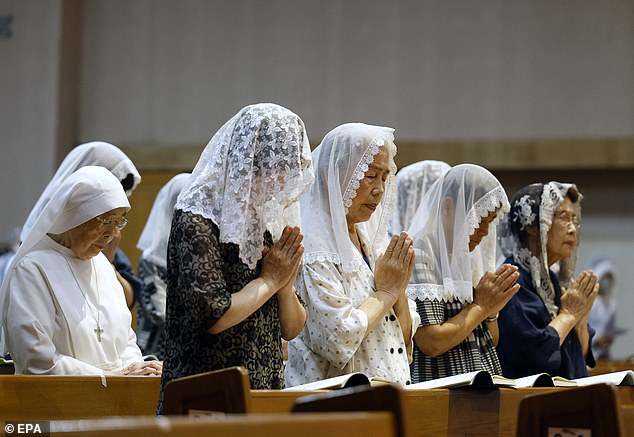 Some survivors and their families prayed at churches in Nagasaki, home to Catholic converts persecuted in feudal times. The twin bells at Urakami Cathedral, which was destroyed in the bombing, also rang together again