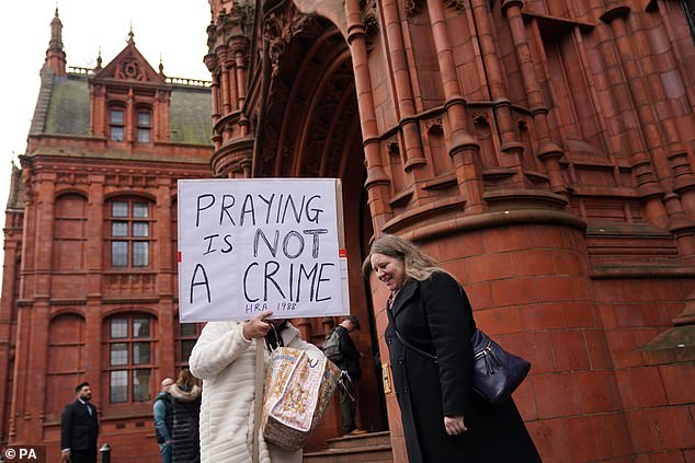 A new law also banned anyone from not intentionally or recklessly obstructing, harassing, alarming or distressing anyone visiting or working at the clinics (protesters outside Birmingham Magistrates' Court)