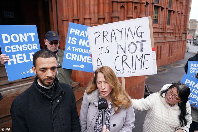 Despite a new law against actions that could influence someone's decision to use abortion services, Ms Vaughan-Spruce (pictured with Father Sean Gough) has continued to pray silently outside clinics every week