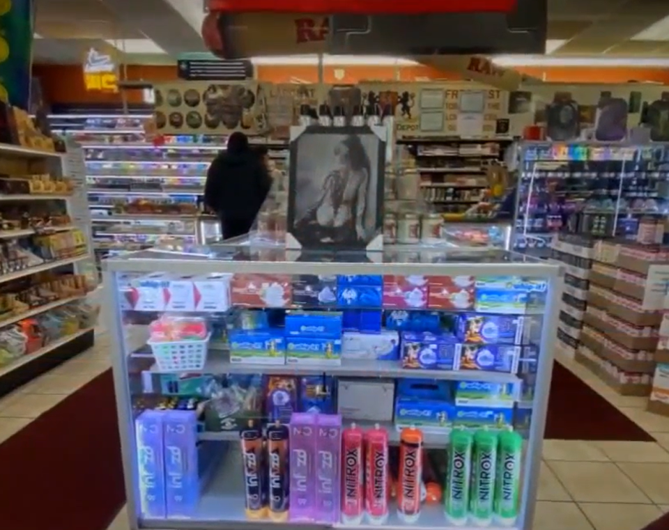 Store display case with various products.