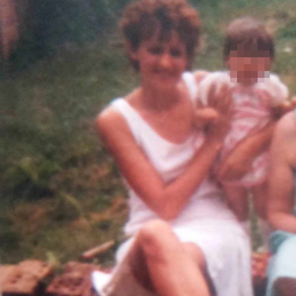 Photo of Tara Proffitt with a child.