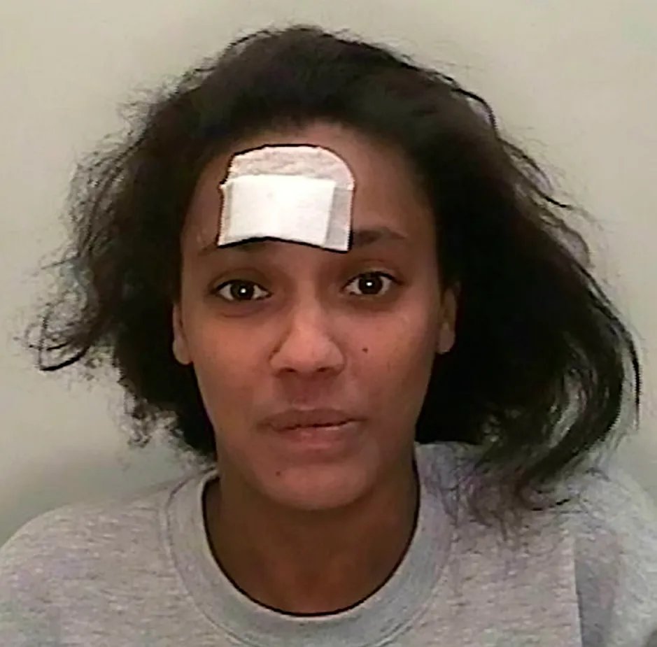 Mugshot of Tara Proffitt with a bandage on her forehead.