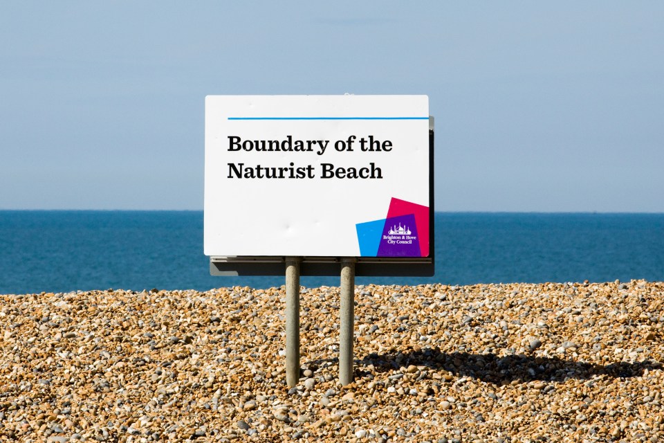 Sign marking the boundary of a naturist beach.