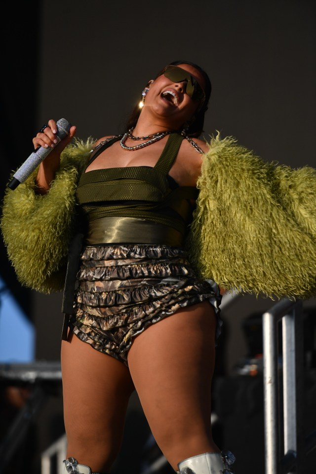 Nelly Furtado performing on stage at a music festival.