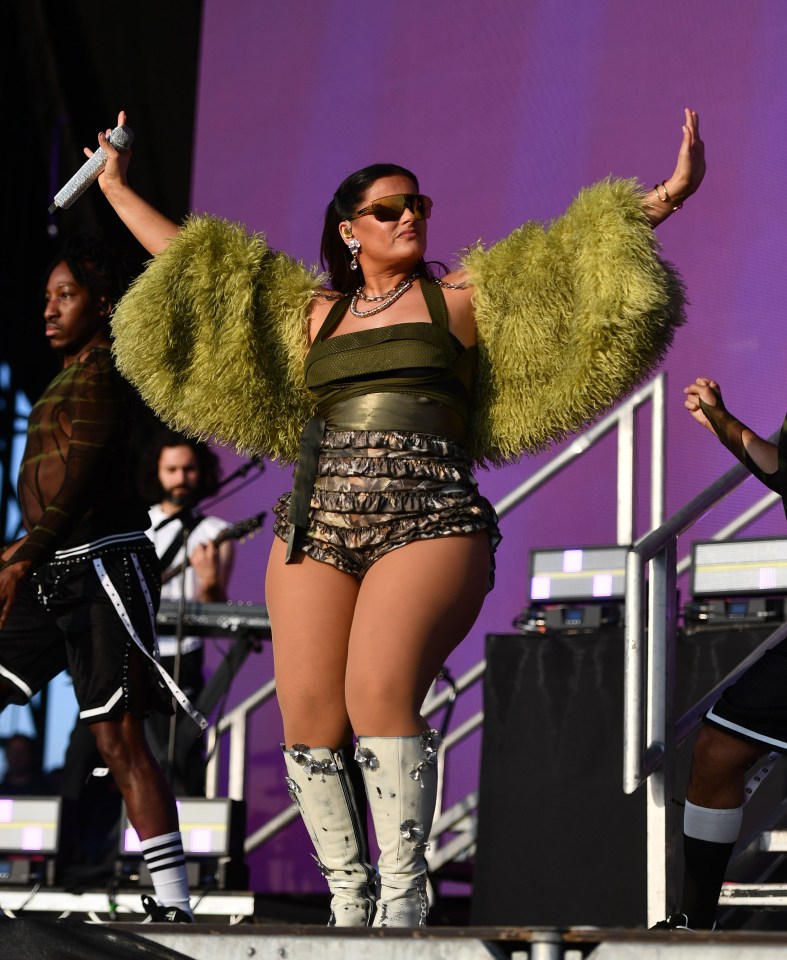 Nelly Furtado performing on stage at a music festival.
