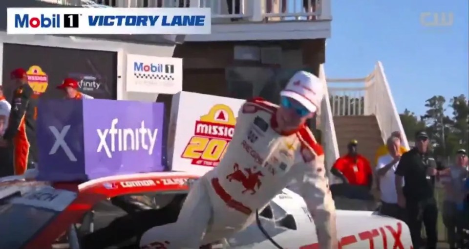Connor Zilisch falling while celebrating his NASCAR Xfinity Series win.