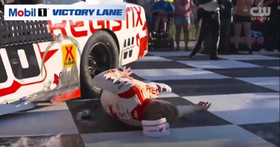 Connor Zilisch falling after winning a NASCAR Xfinity Series race.