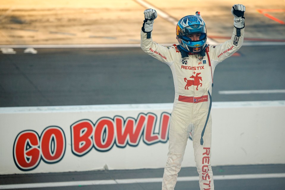 Connor Zilisch, driver of the #88 Registix Chevrolet, celebrates a NASCAR Xfinity Series win.