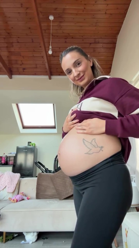Pregnant woman showing her baby bump.