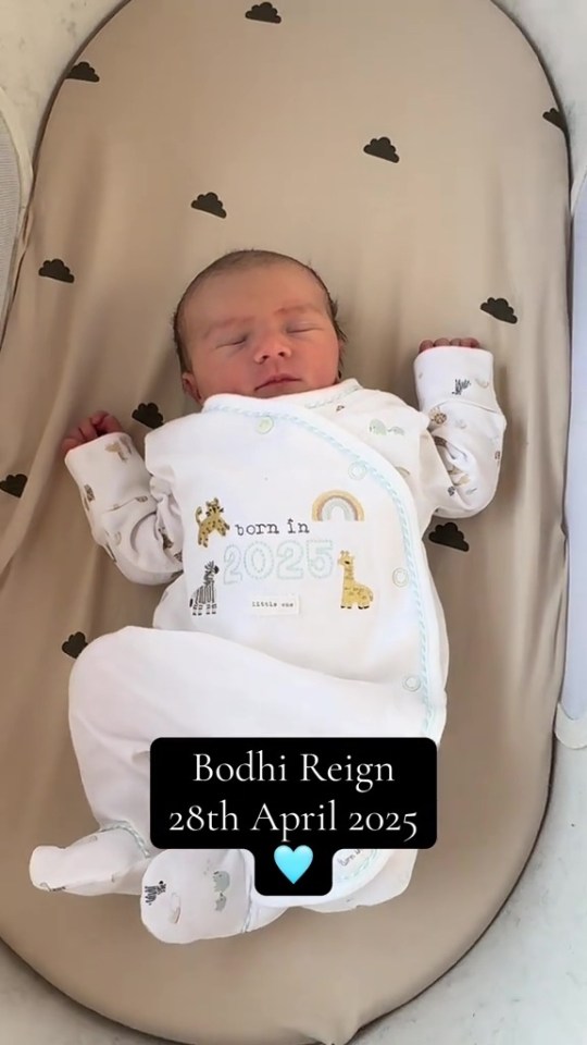 Newborn baby Bodhi Reign sleeping in bassinet.