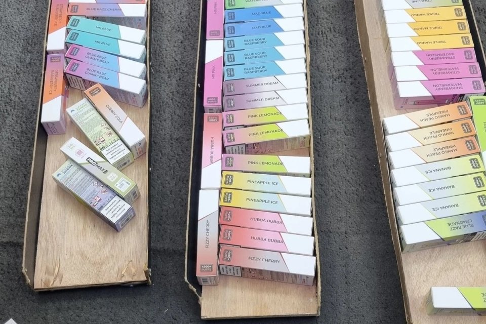 Seized vape boxes in various flavors.