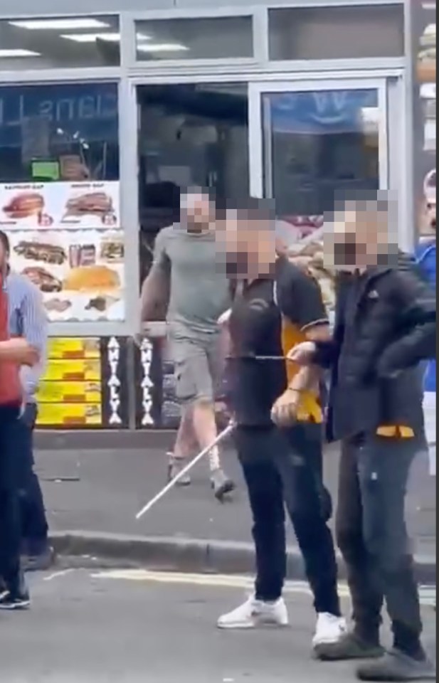 Street brawl with multiple people involved.