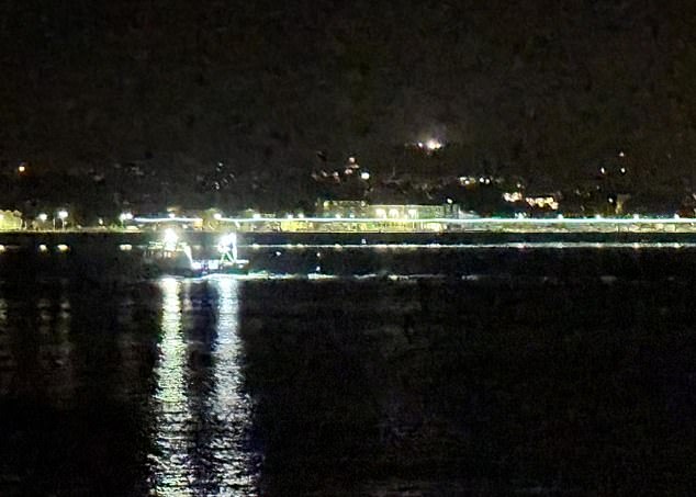 Pictured: A fishing boat makes its way into Newlyn Harbour in the early hours of the morning