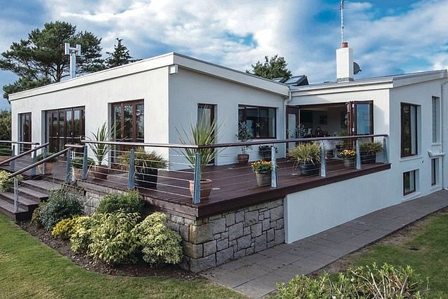 The comic, 54 is lying low in his stylish country home (pictured) in the village of Dundrum, County Down where family and friends have been rallying around him following the announcement that he and Cat, 48, have split after 12 years of marriage